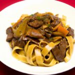 Savory Beef Tips & Gravy: Perfect Comfort Over Egg Noodles